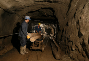 Miners transportting materials